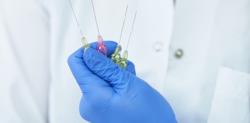 Beautician holding polydioxanone thread for lifting over light background